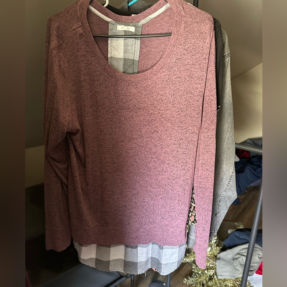 Plum colored shirt with gray/white plaid under lining 
ties in back